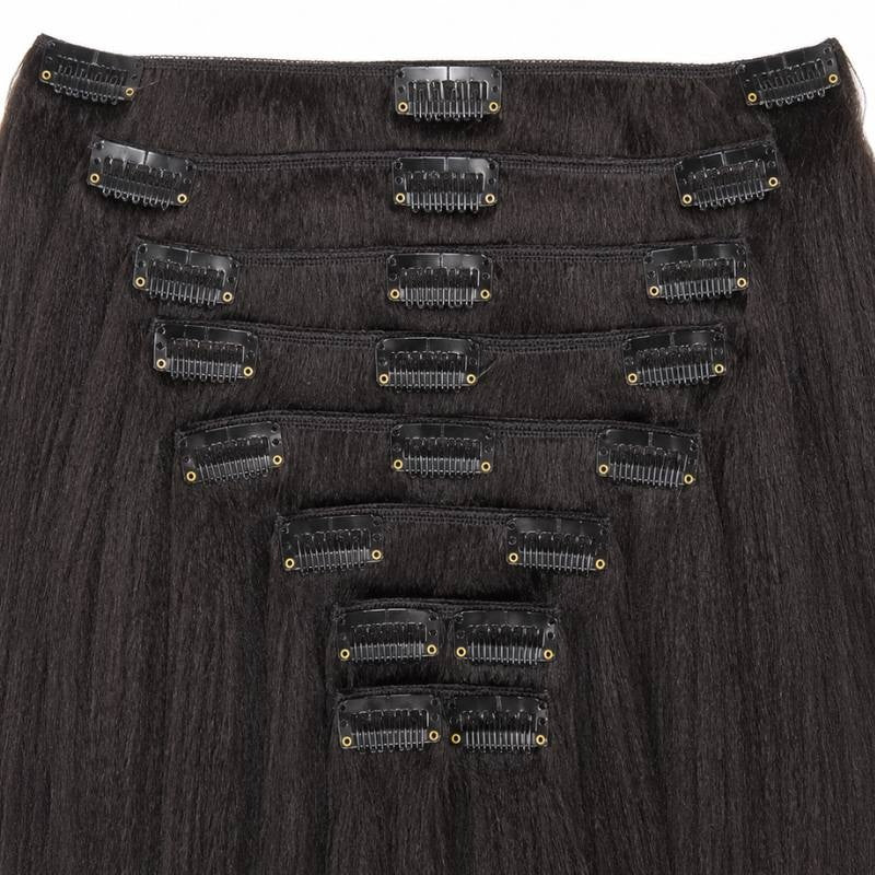 Reverse side of natural black kinky straight clip-in hair extensions showing the black snap clips stitched along each weft