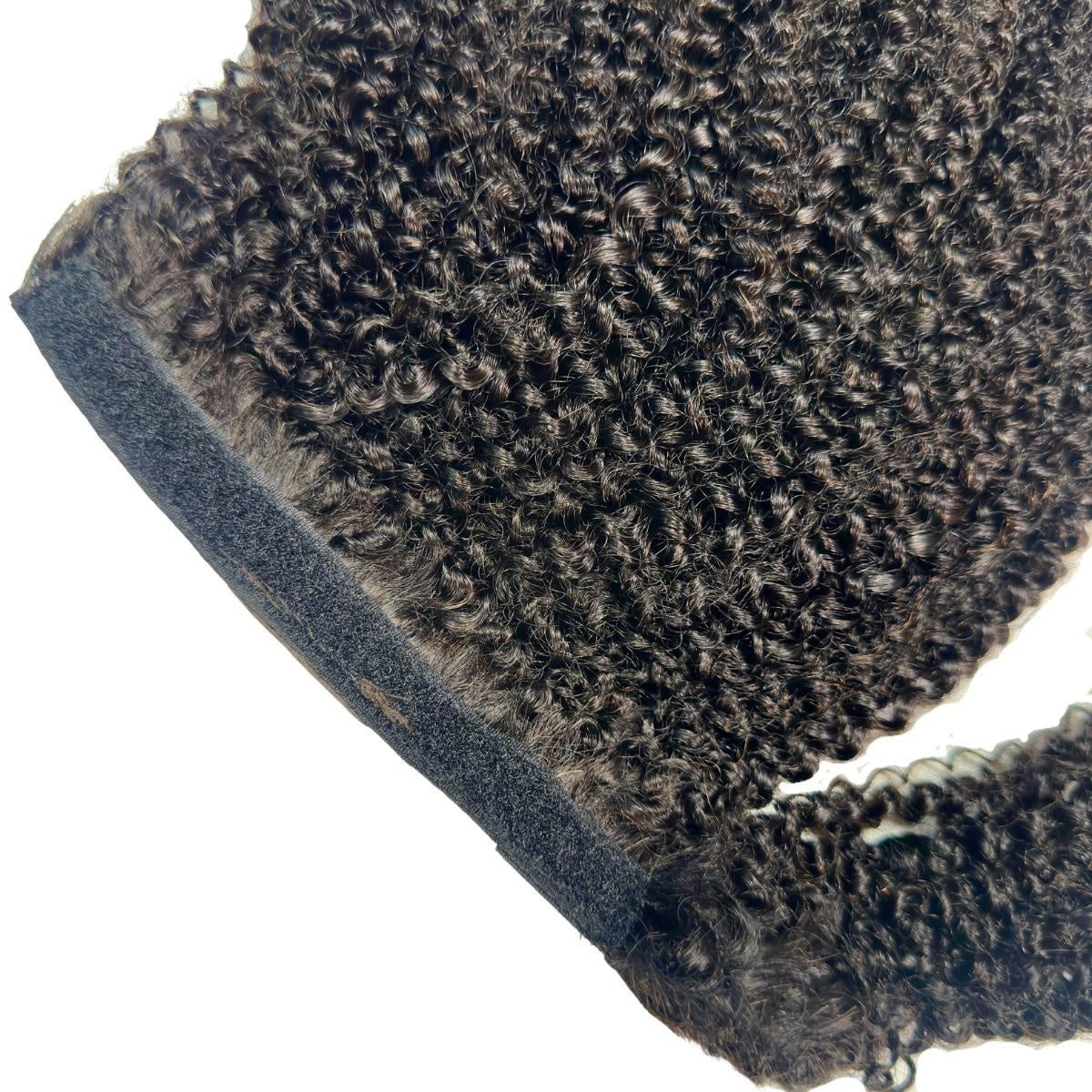 Afro Kinky Curly Ponytail - Afro kinky curly natural black 1B ponytail attachment detail with black velcro wrap strap and coily texture