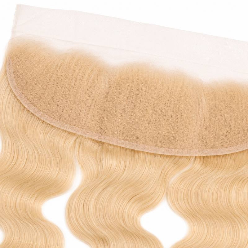 Close-up of the lace mesh and knotted hairline on the blonde 613 body wave transparent frontal above the waved hair extensions