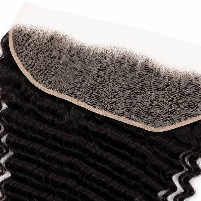 Angled close-up of the lace hairline on the natural black deep wave transparent frontal with the wave of the hair extensions running beside it