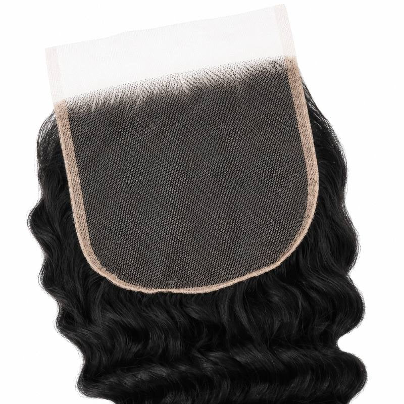 Close-up of the square lace panel and knotted roots on a natural black 5x5 HD closure with deep wave hair extensions framing it