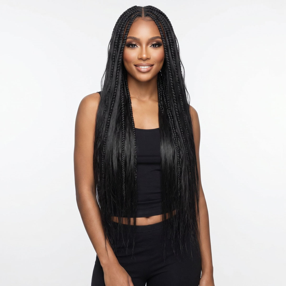 Model wearing long knotless box braids in natural black made with straight bulk braiding hair extensions, front view on a white studio background