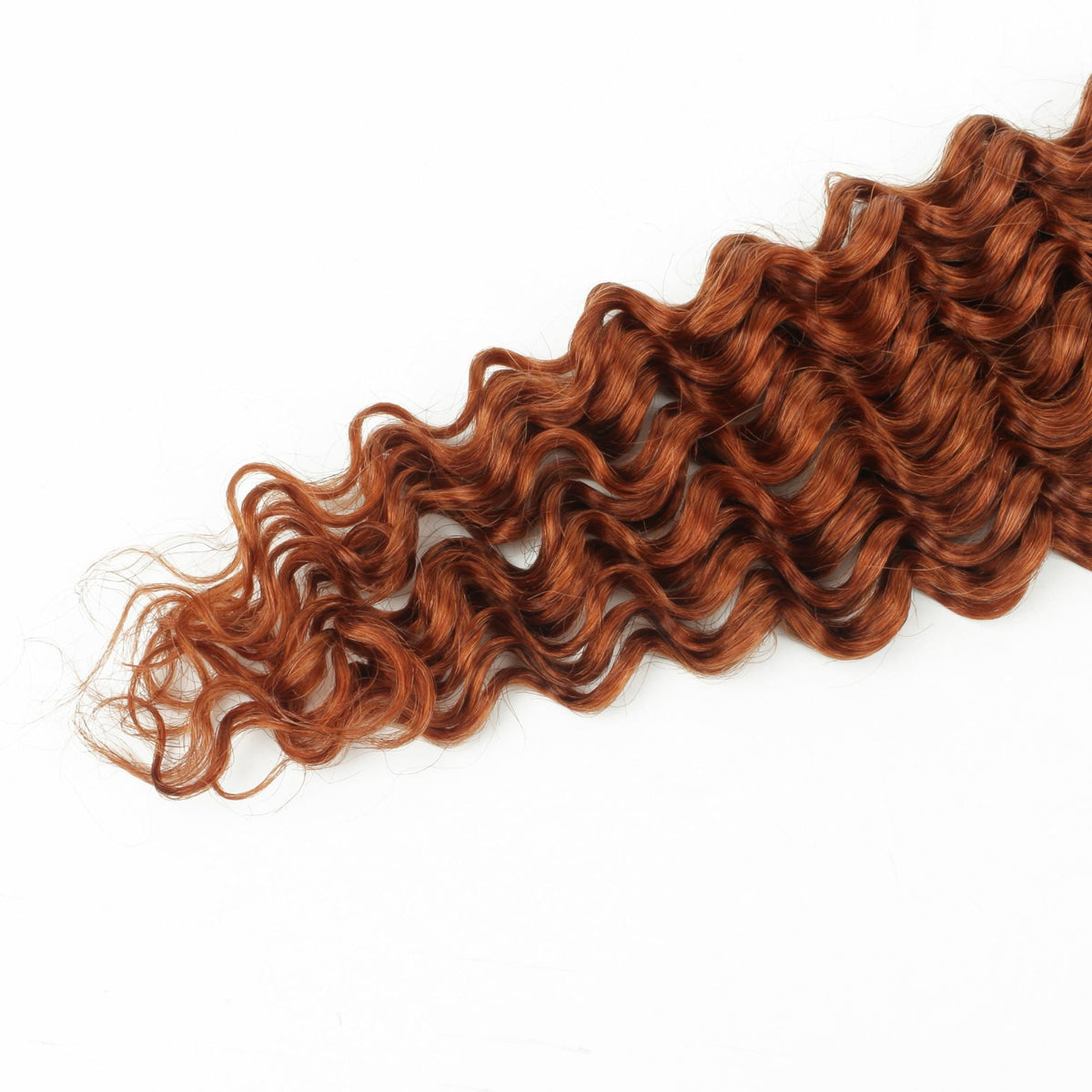 Close-up of the deep wave pattern and tapered ends on copper bulk braiding hair extensions against a white background