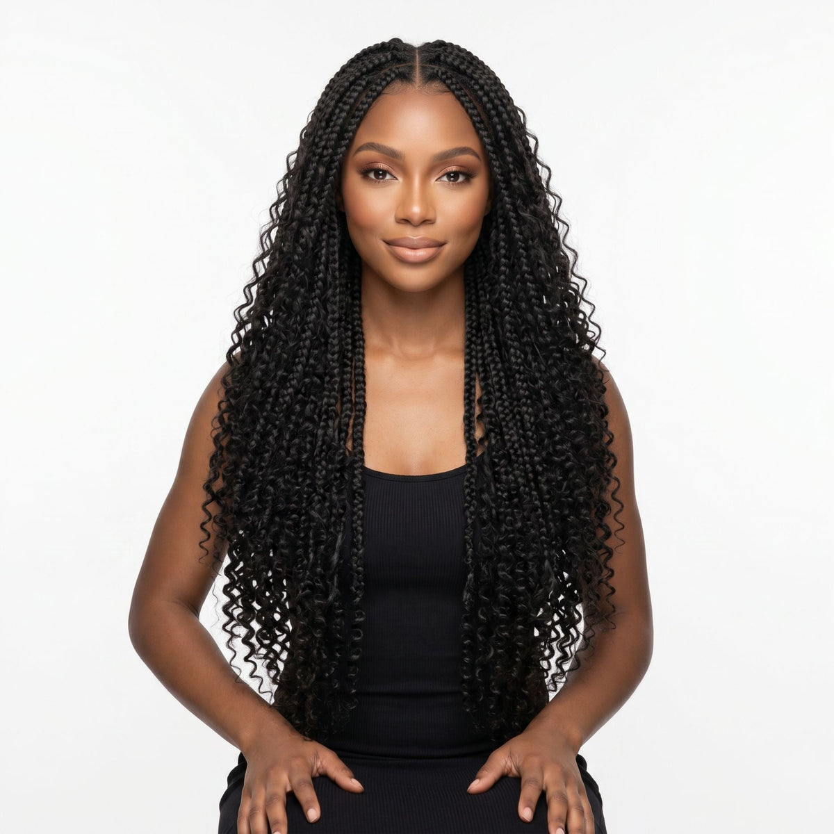 Model wearing natural black kinky curly bulk braiding hair extensions in long box braids with loose coiled ends on a white background