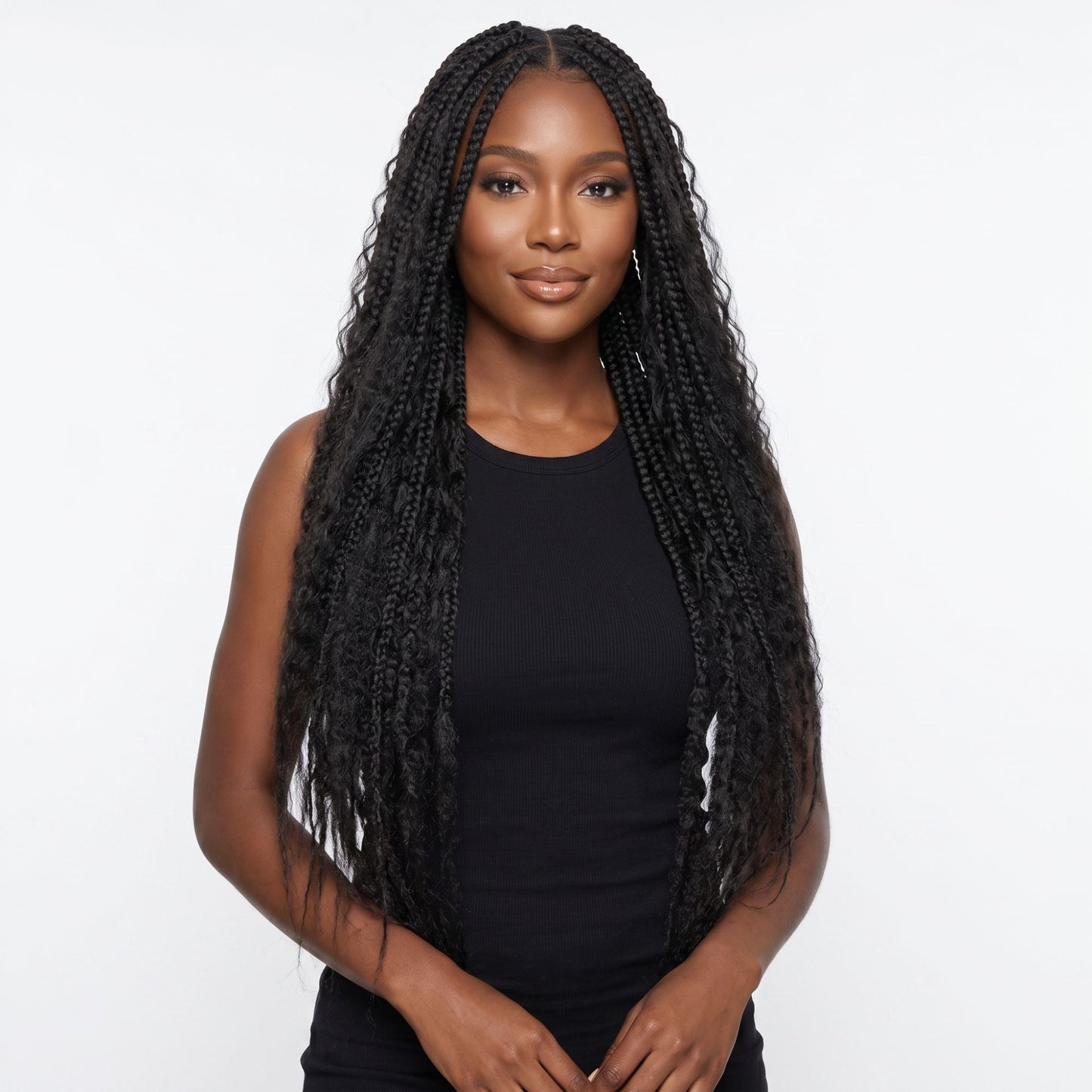 Model wearing natural black kinky straight bulk braiding hair extensions in long box braids with loose textured ends on a white background
