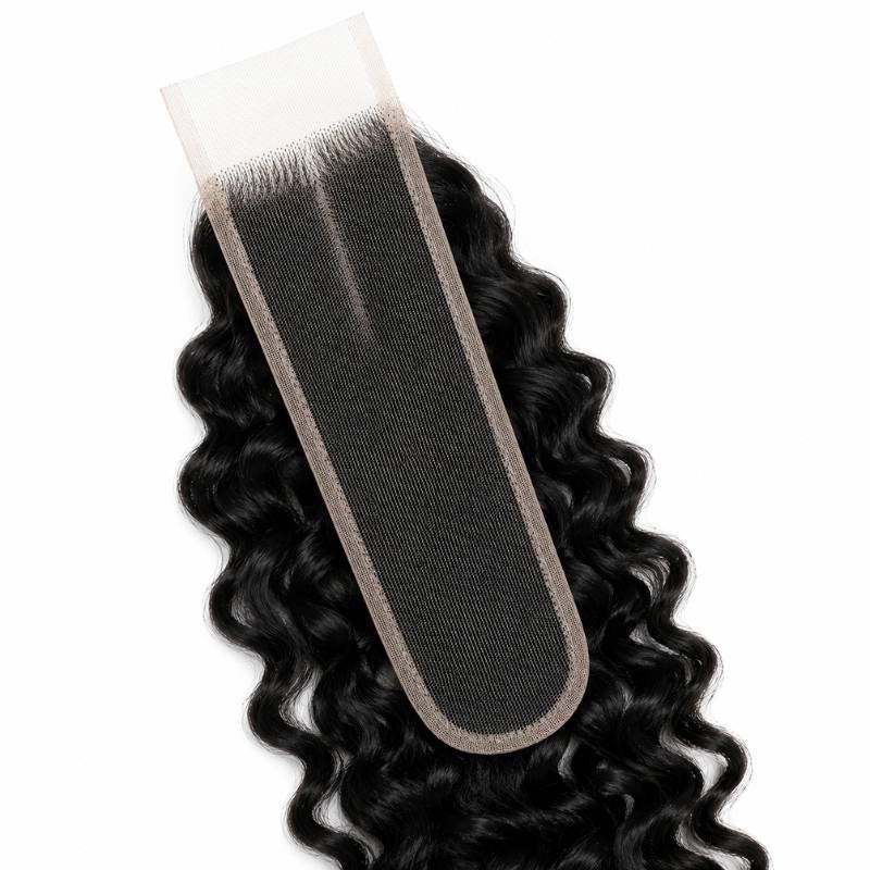 Close-up of the narrow rounded lace base on natural black spiral wave lace closure hair extensions with curls falling around it