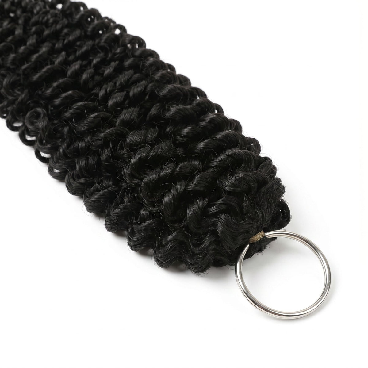 Macro close-up of the ring end and tight water wave curls on natural black crochet hair extensions