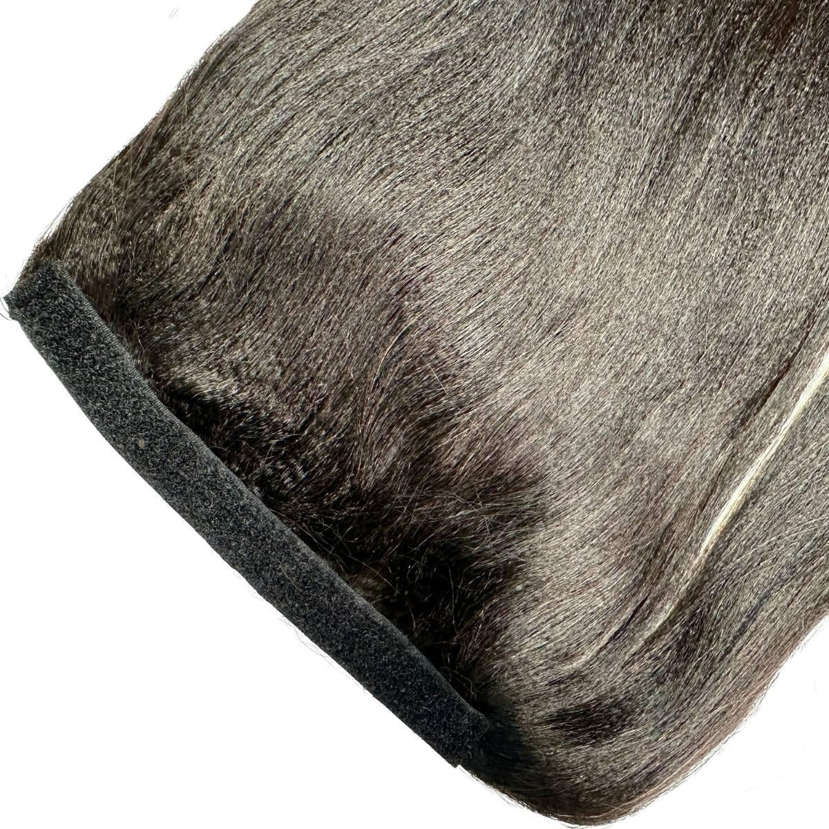Yaki Straight Ponytail - Detail of natural black 1B yaki straight ponytail wrap strip with velcro closure and silky texture on white