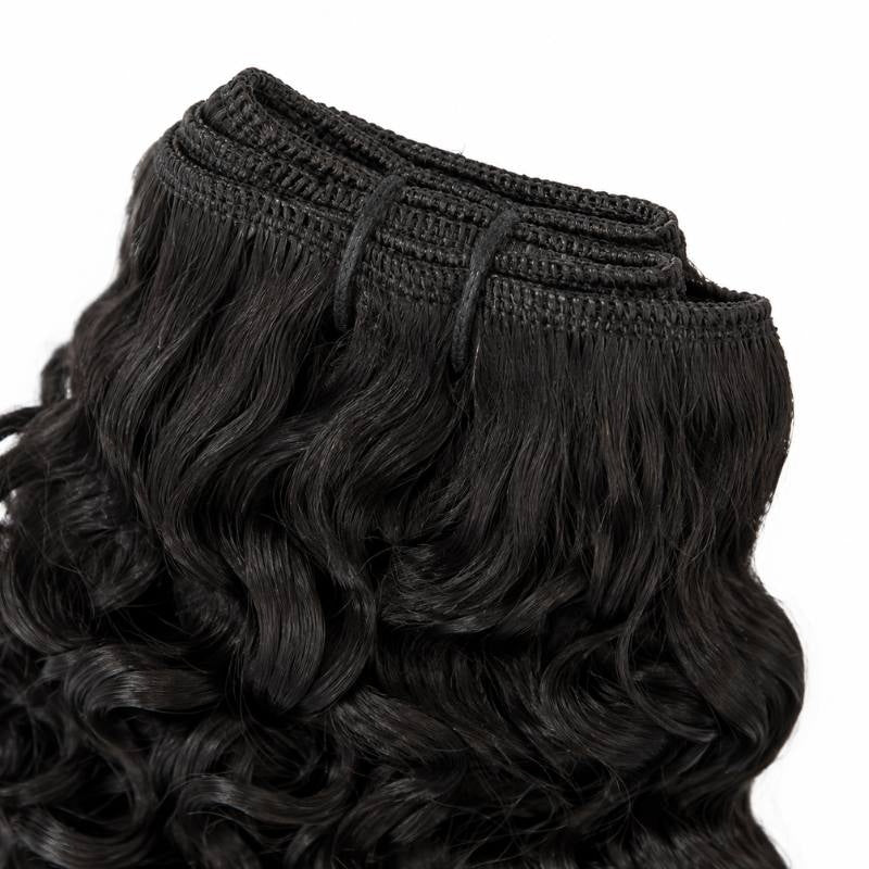 Close-up of the stitched weft track on natural black curly sew-in hair extensions with the curls falling below the seam