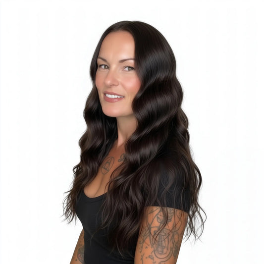 Woman with long, wavy brown hair on a white background