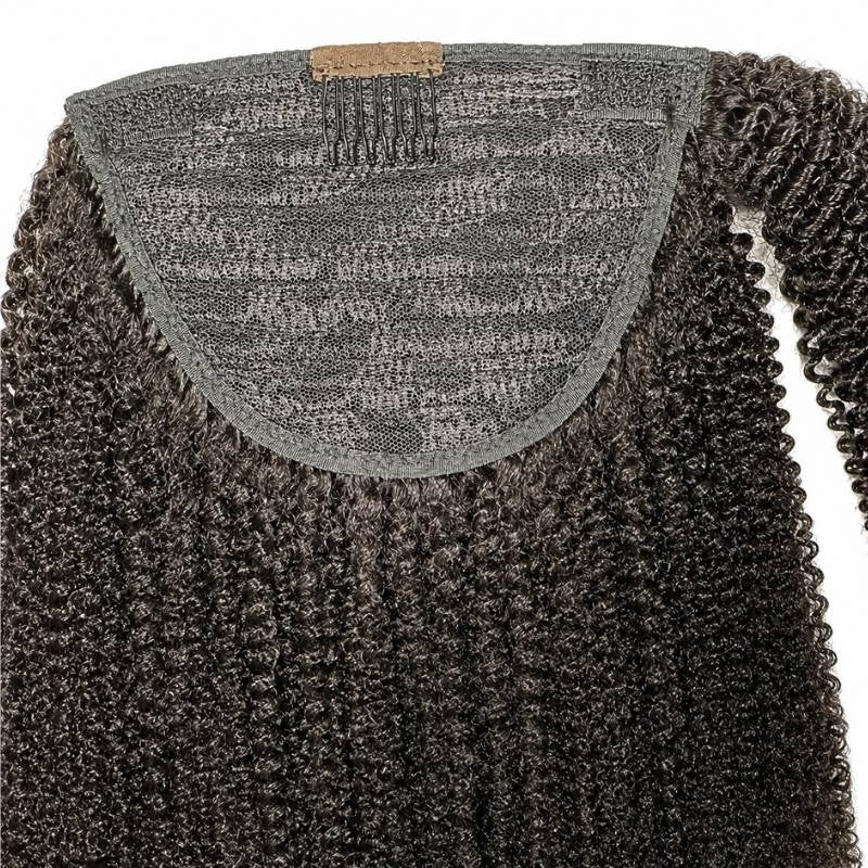 Interior of the ponytail base on natural black afro kinky curly hair extensions showing the mesh net panel and the pressure comb