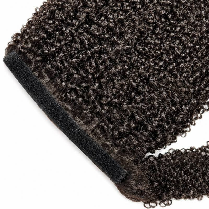 Close-up of the black hook and loop wrap strap along the base of natural black afro kinky curly ponytail hair extensions