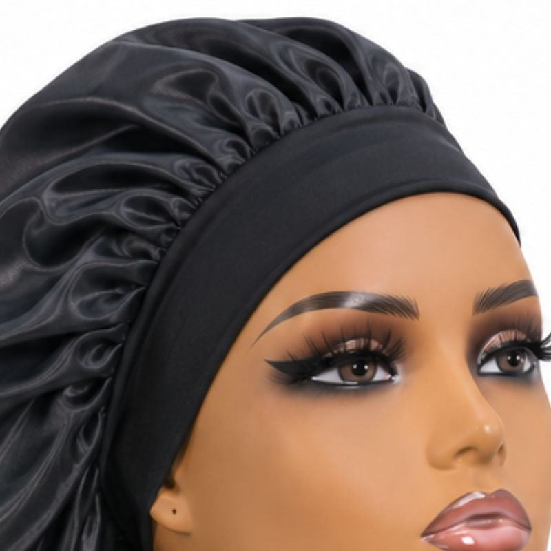 Close-up of the wide black elastic band and gathered silk on the long bonnet worn over hair extensions on a mannequin head