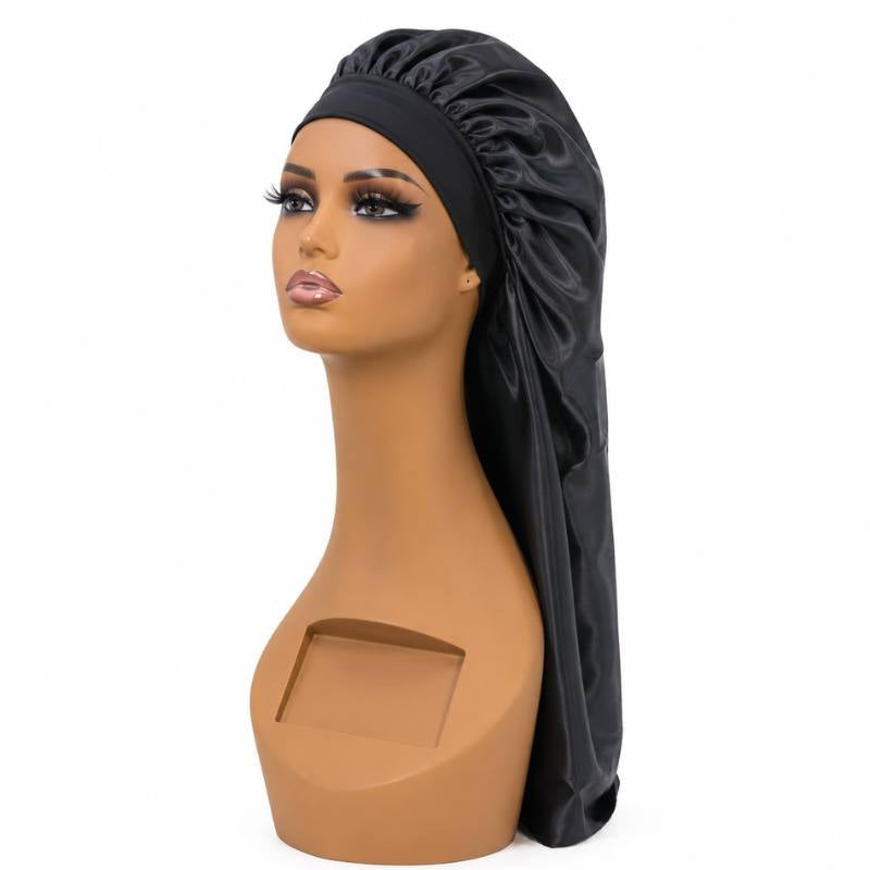 Black long silk bonnet on a mannequin head with a wide elastic band and an extended tube for sleeping in long hair extensions