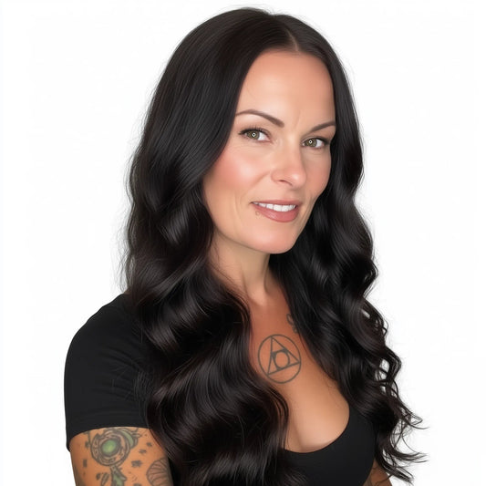 Woman with long, dark hair and tattoos on a white background