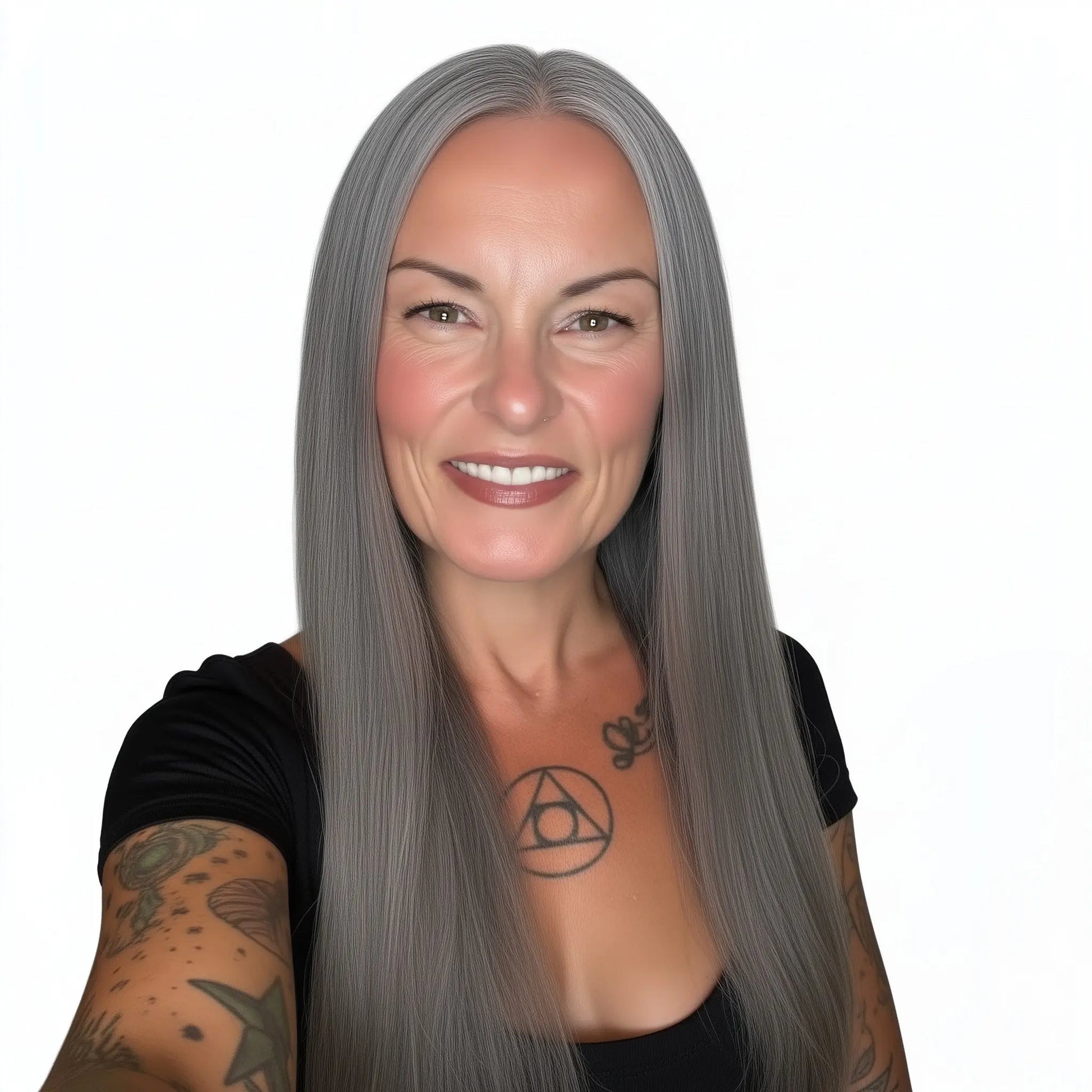 Woman with long gray Vietnamese Silk Straight hair and tattoos on a white background