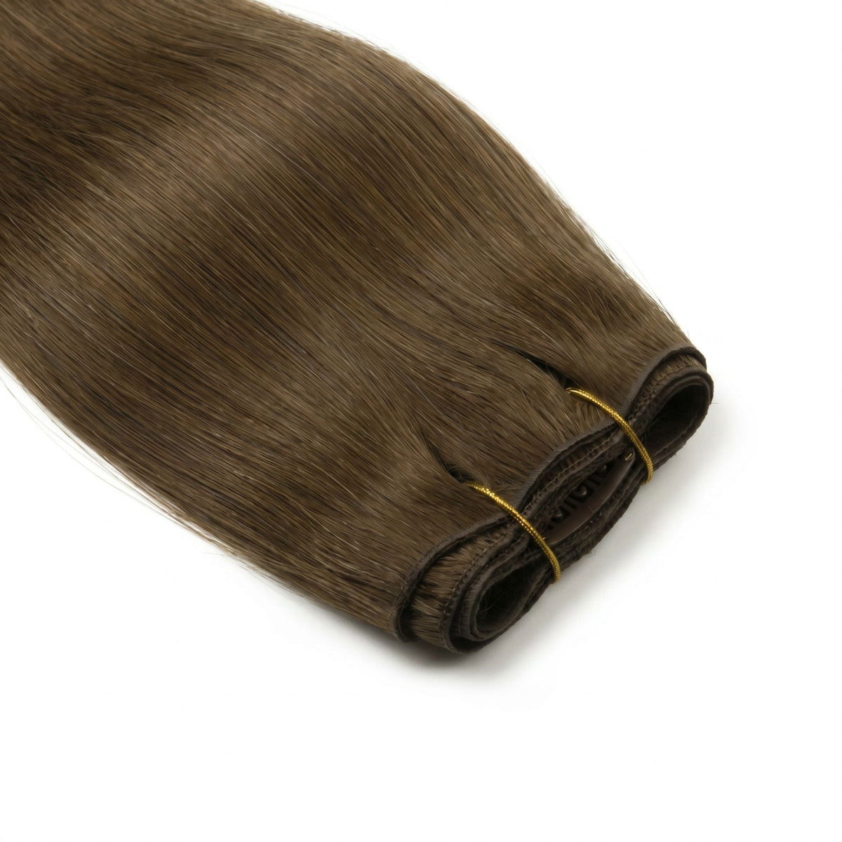 Close-up of the folded weft edge on chocolate brown straight clip-in hair extensions held together by a gold thread tie