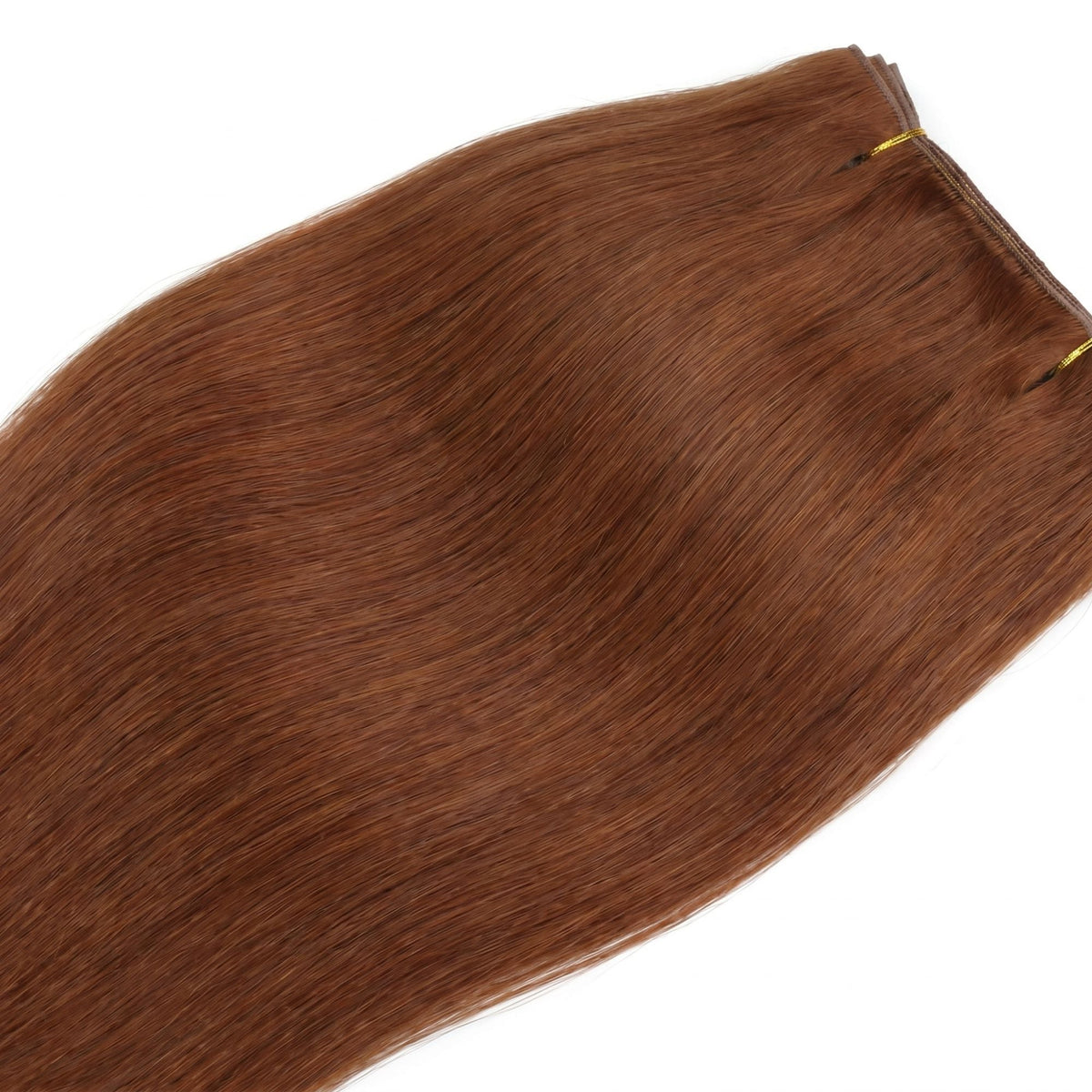 Close crop of the straight copper hair on the clip-in hair extensions showing the even colour and smooth cuticle along the lengths