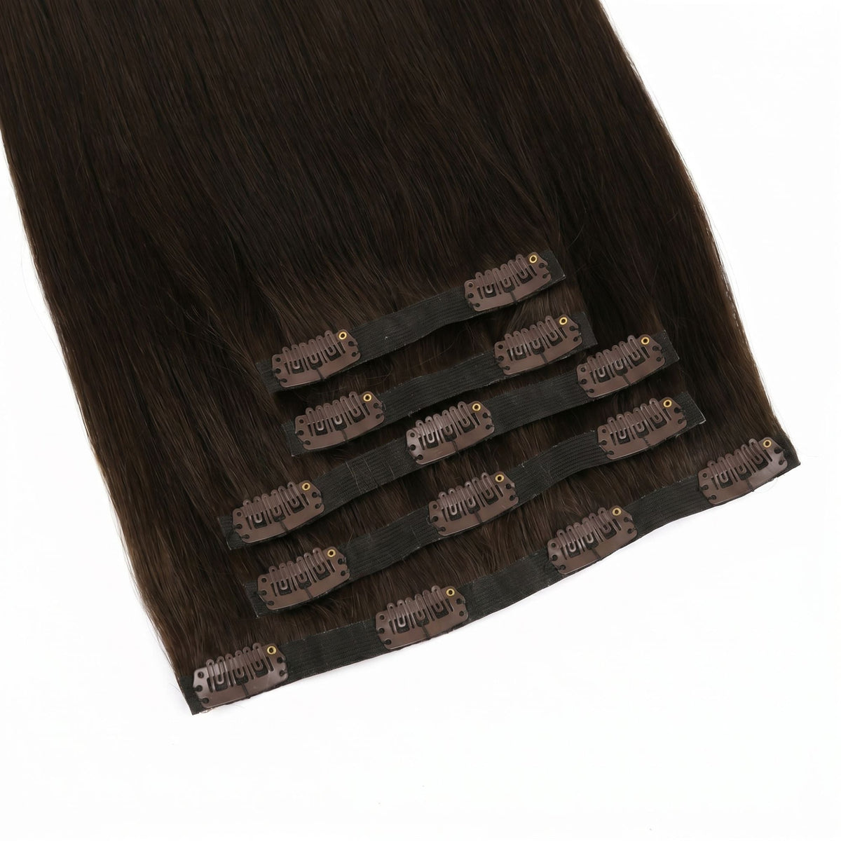 Close-up of the thin polyurethane bands and snap clips on dark brown straight clip-in hair extensions laid on a white surface