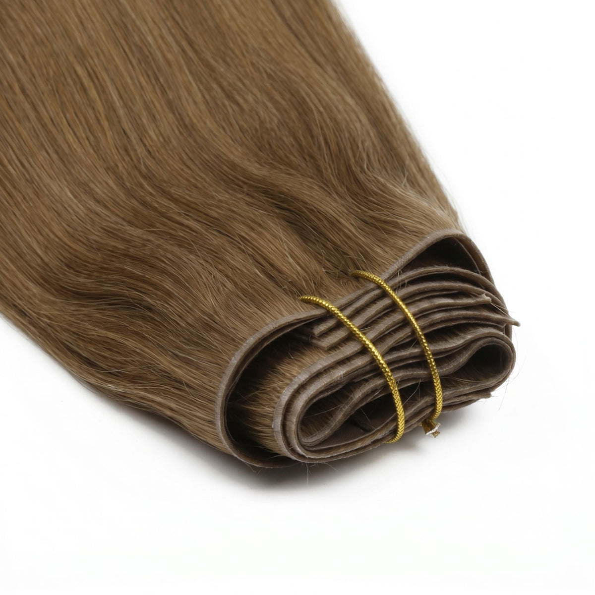 Close-up of the folded weft ends on chestnut brown straight clip-in hair extensions bound with a gold thread tie