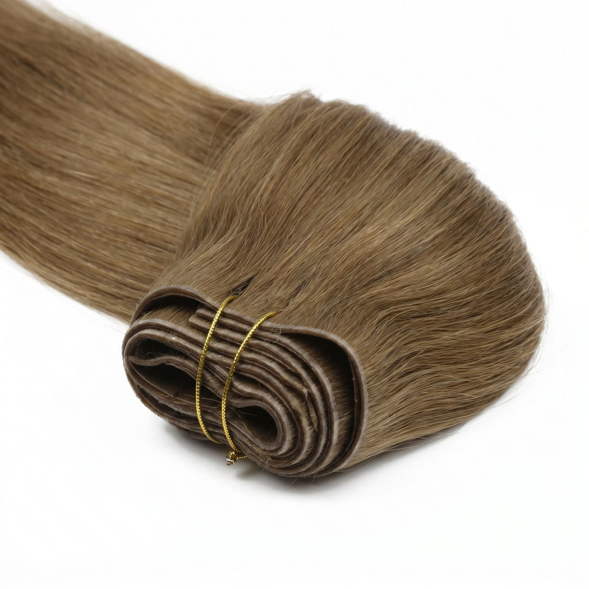Angled view of the stacked folded wefts on chestnut brown straight clip-in hair extensions tied with gold thread