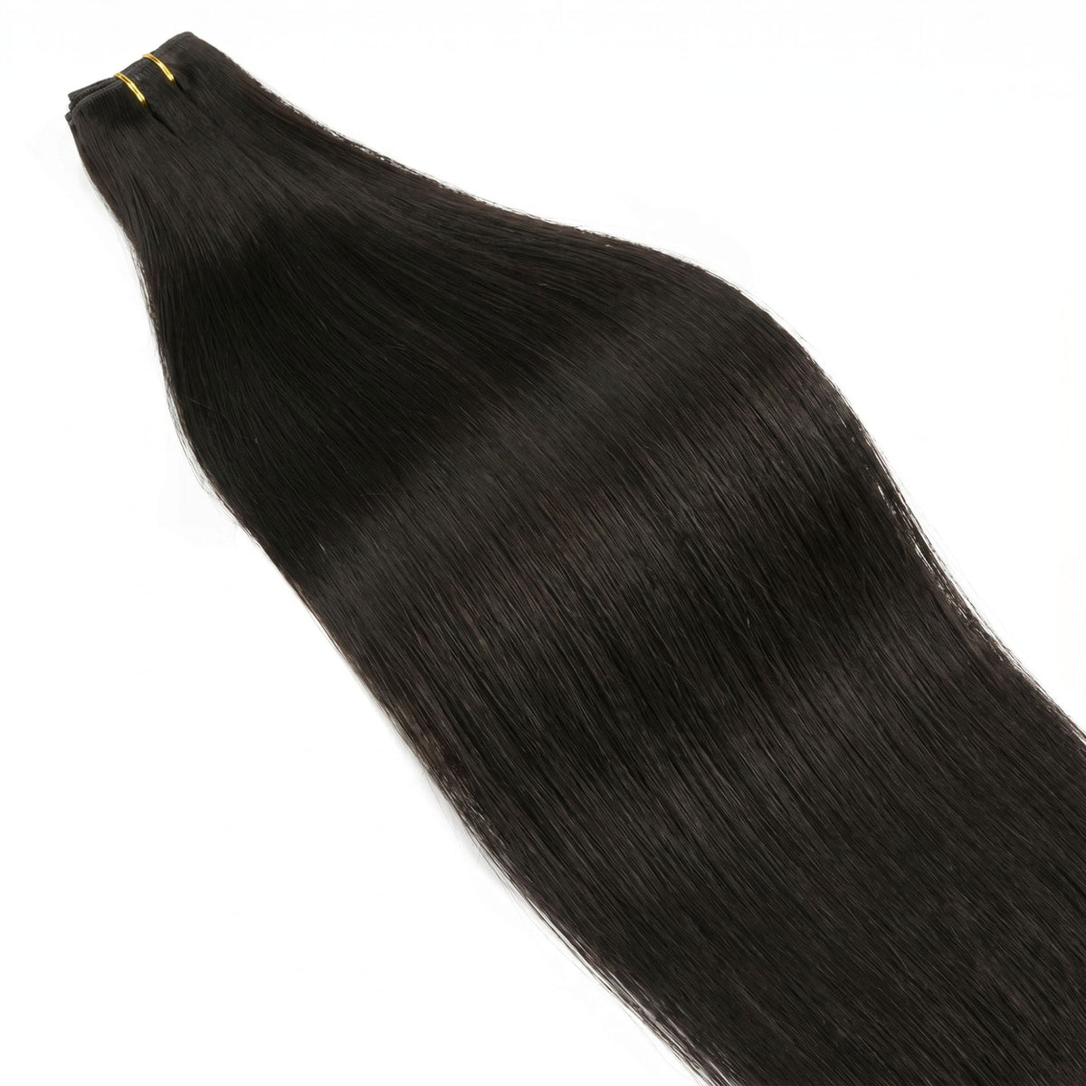 Off black straight clip-in hair extensions laid flat with the weft tied by gold thread at the top and the hair spread below