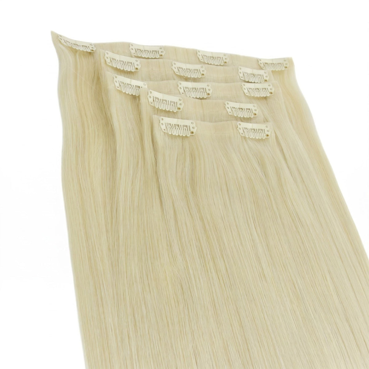 Full set of platinum blonde straight clip-in hair extensions laid flat with the bands and snap clips facing up