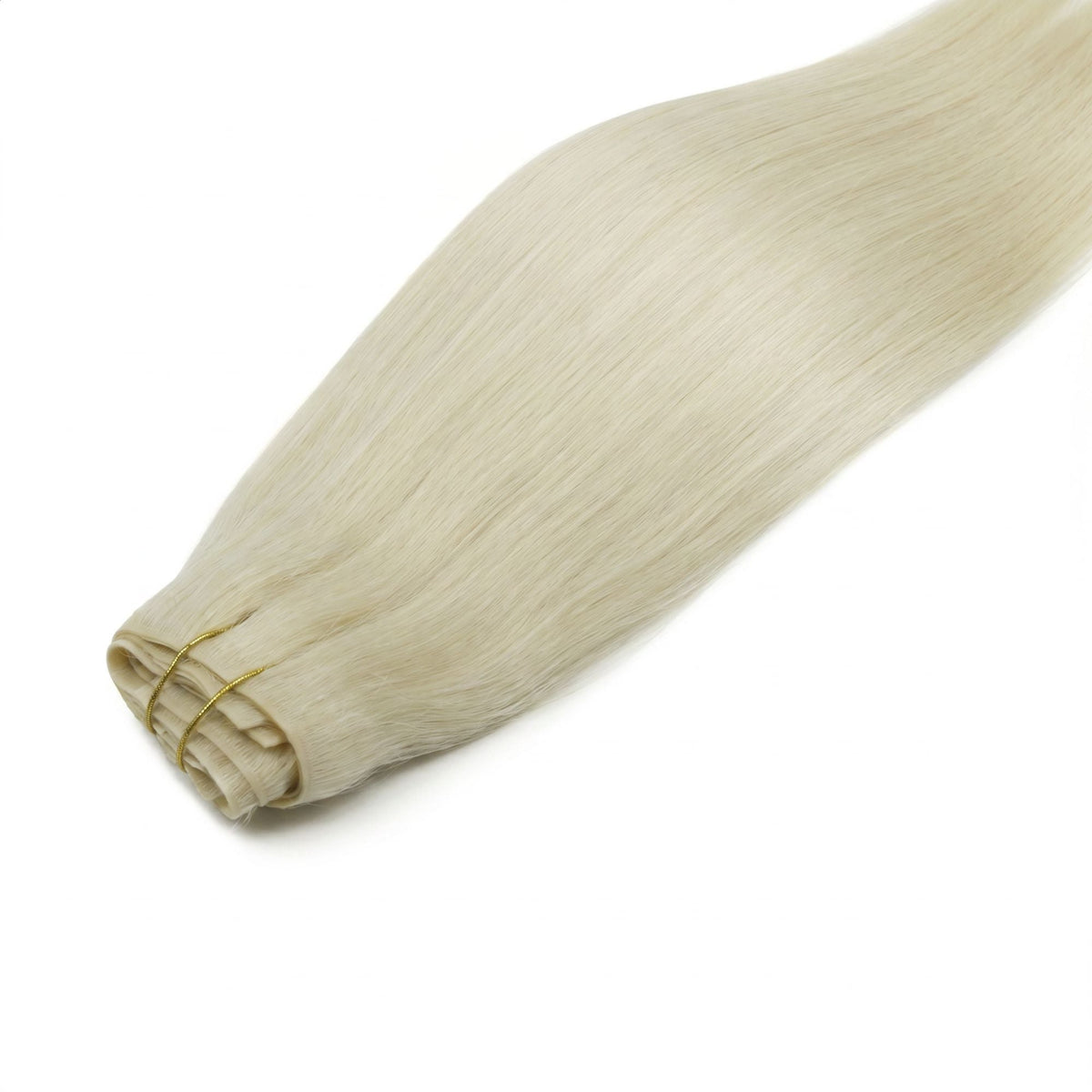 Platinum blonde straight clip-in hair extensions laid flat with the folded weft bound by gold thread and the hair fanning out