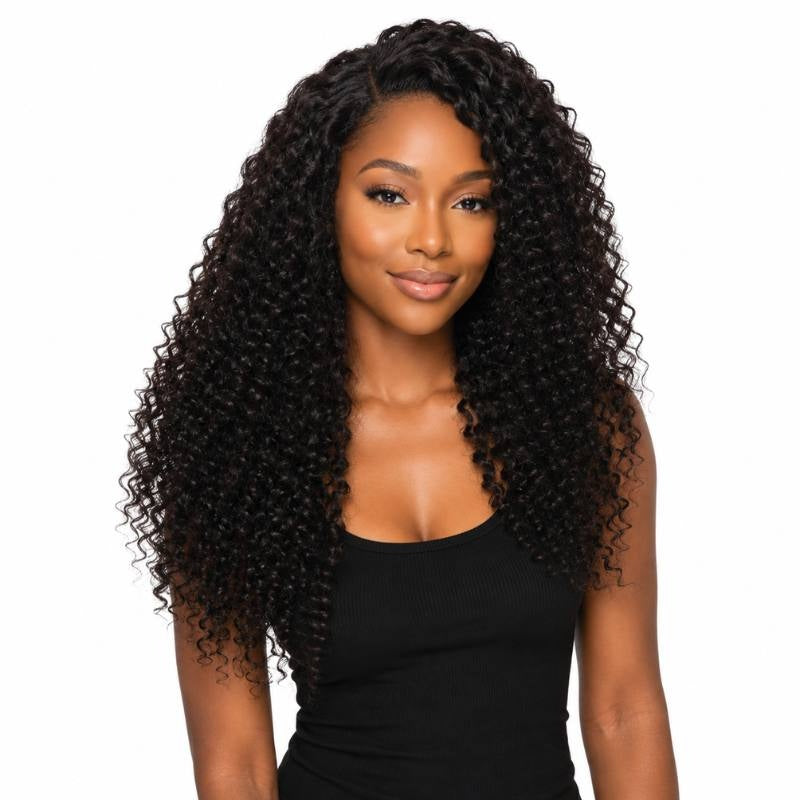 Model facing forward wearing natural black kinky curly clip-in hair extensions with a centre part and defined curls to the chest