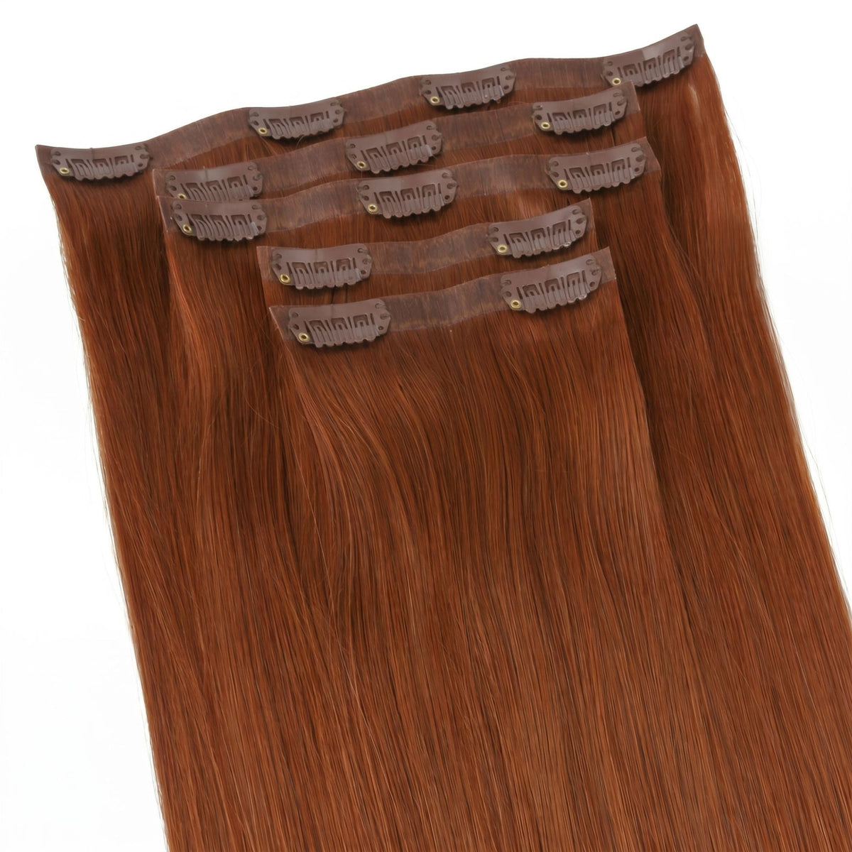 Copper straight clip-in hair extensions fanned at an angle so the clips on each seamless weft can be counted across the set