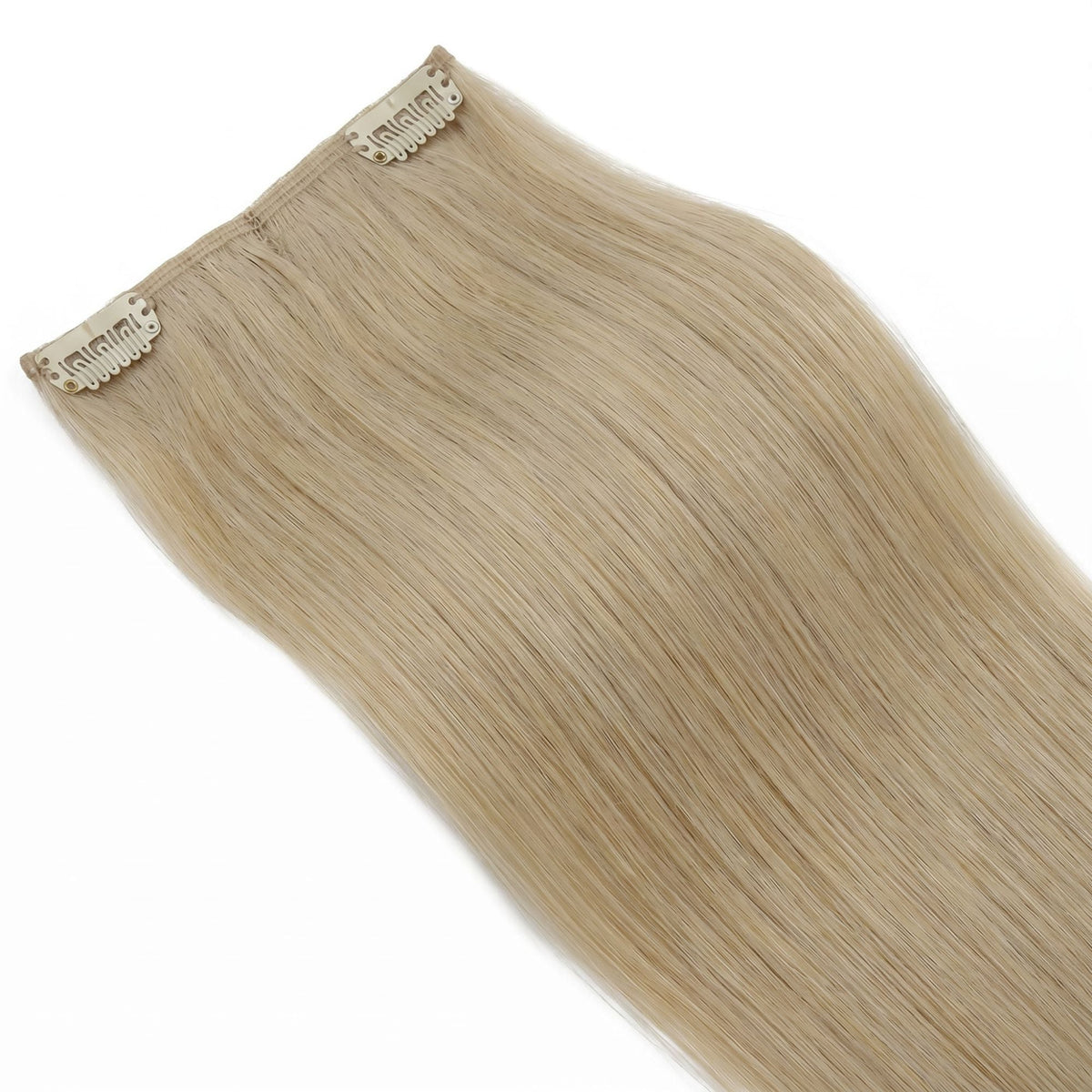 Close-up of one seamless weft of honey blonde straight clip-in hair extensions showing the pale clips along the flat band
