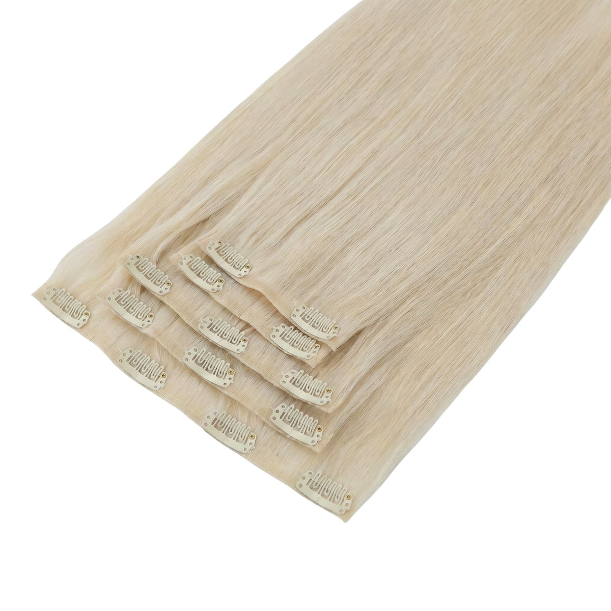 Full set of platinum blonde straight clip-in hair extensions laid flat and stacked, showing the snap clips attached along each weft