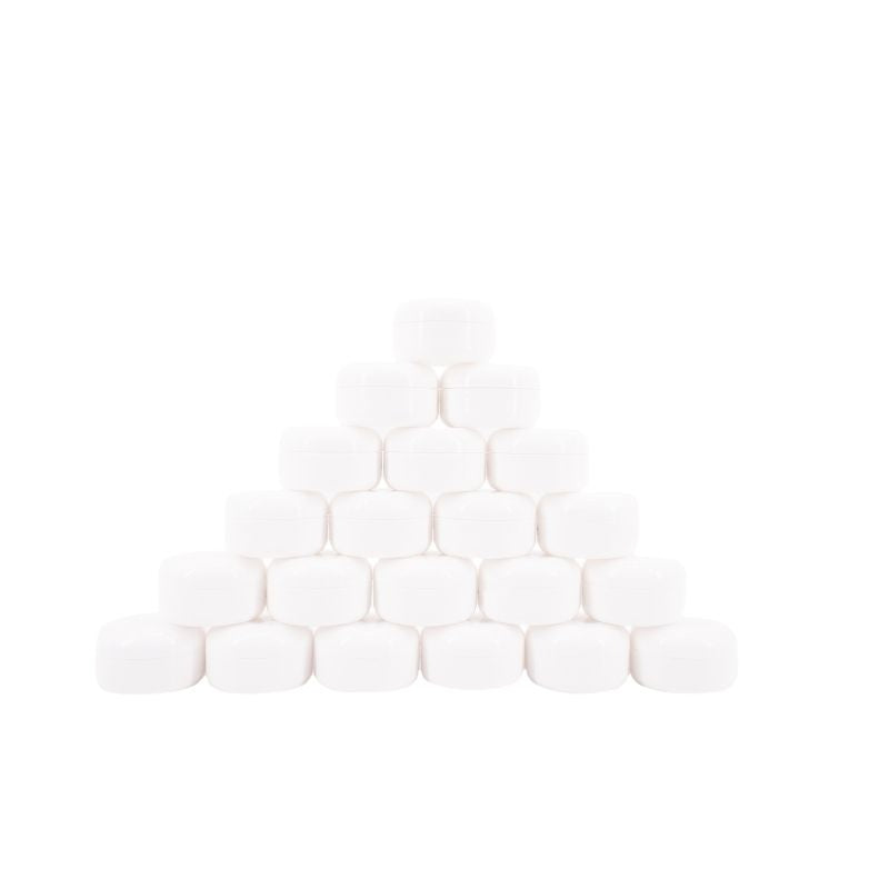 Pyramid stack of closed white edge control jars on a white background, a styling gel stocked alongside hair extensions