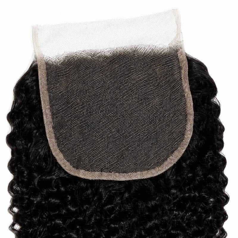 Detail of the square transparent lace closure panel with tightly coiled natural black curly hair extensions framing the lace