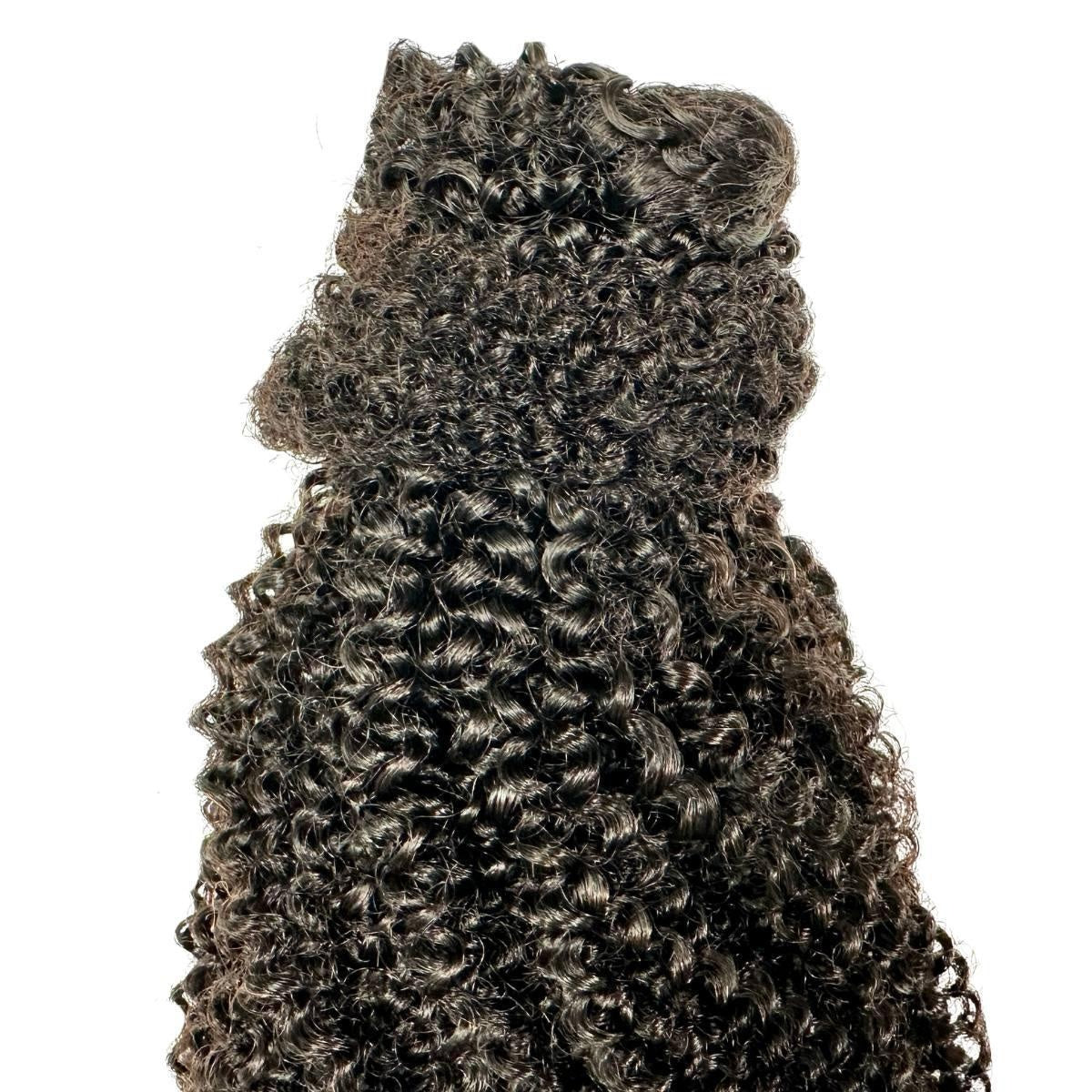 Afro Kinky Curly Ponytail - Close-up of afro kinky curly natural black 1B human hair ponytail showing dense tight coily curl texture
