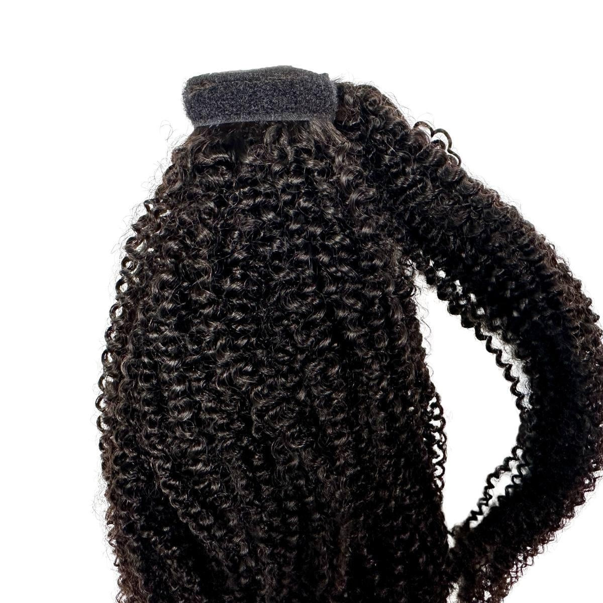 Afro Kinky Curly Ponytail - Afro kinky curly natural black 1B wrap ponytail showing velcro top band and full coily length, side view