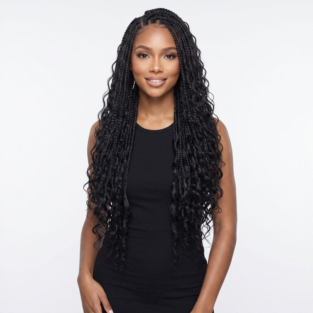 Model wearing long boho knotless braids with loose wavy ends made from natural black beach wave bulk braiding hair extensions on a white background