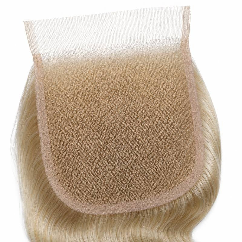 Close-up of the square transparent lace panel with blonde body wave hair extensions knotted around its edges on a white background