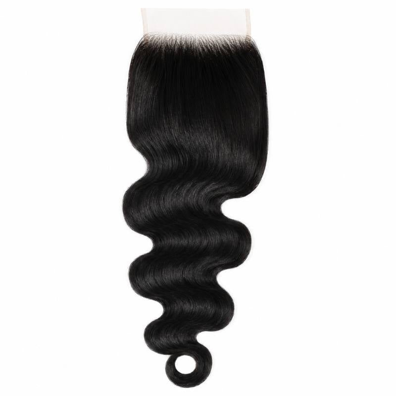 Jet black body wave hair extensions on a square HD lace closure hanging against white, showing the wave and a curl at the tip