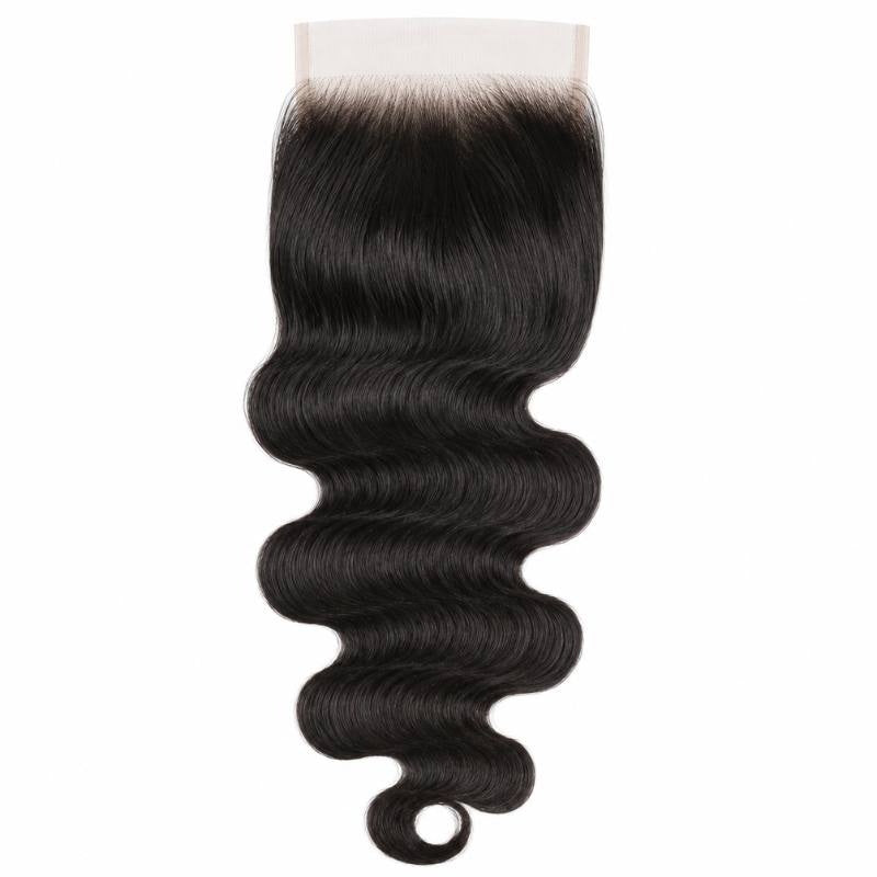 Natural black body wave hair extensions on a wide square HD lace closure hanging against white with the wave running to a curled end