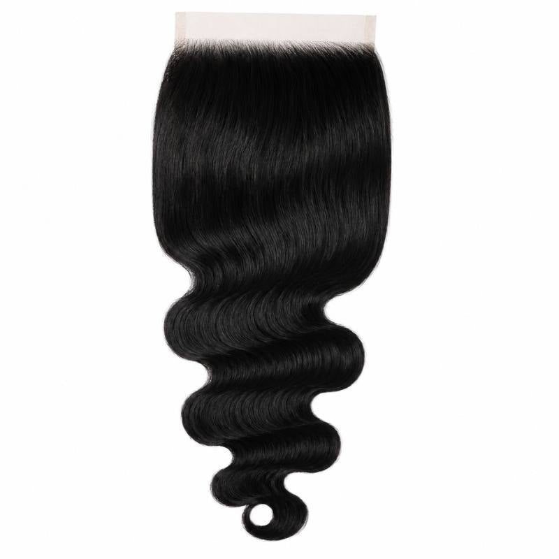 Jet black body wave hair extensions on a large square HD lace closure hanging against a white background with a curled tip