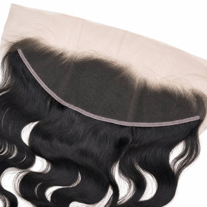 Close-up of the lace mesh and knotted hairline on a natural black body wave HD lace frontal above the waved hair extensions