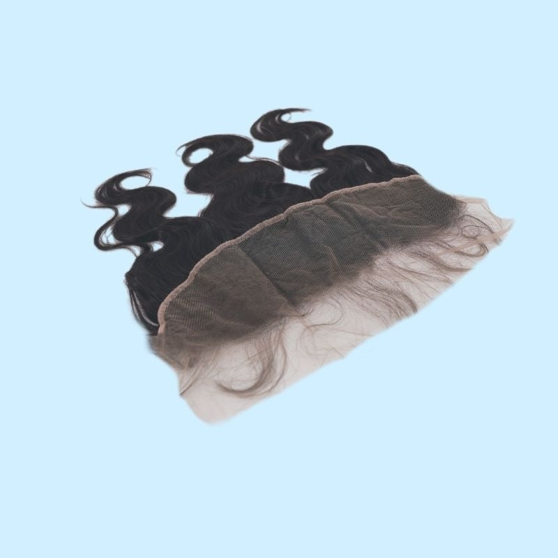 Natural black body wave transparent frontal tilted on a blue background so the lace panel faces the camera with the hair extensions behind