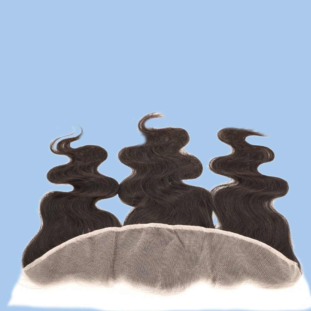 Natural black body wave transparent frontal on a blue background with the lace panel toward the camera and three waved lengths of hair extensions behind