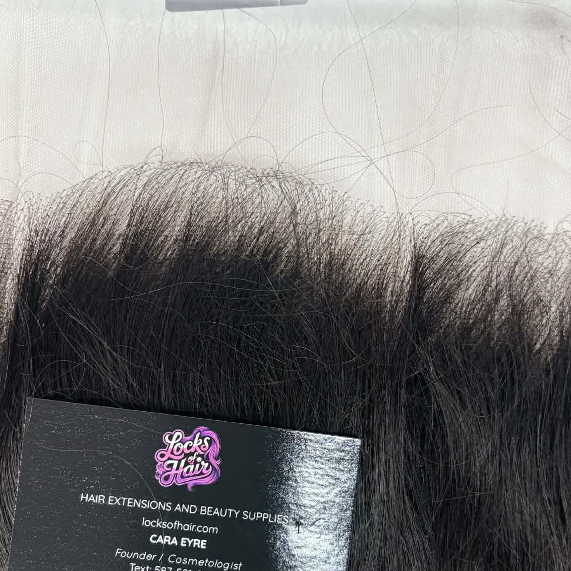 14 inch Brazilian body wave 13x6 HD lace frontal hair extension displayed on gold tray with business card showing lace base and wave pattern