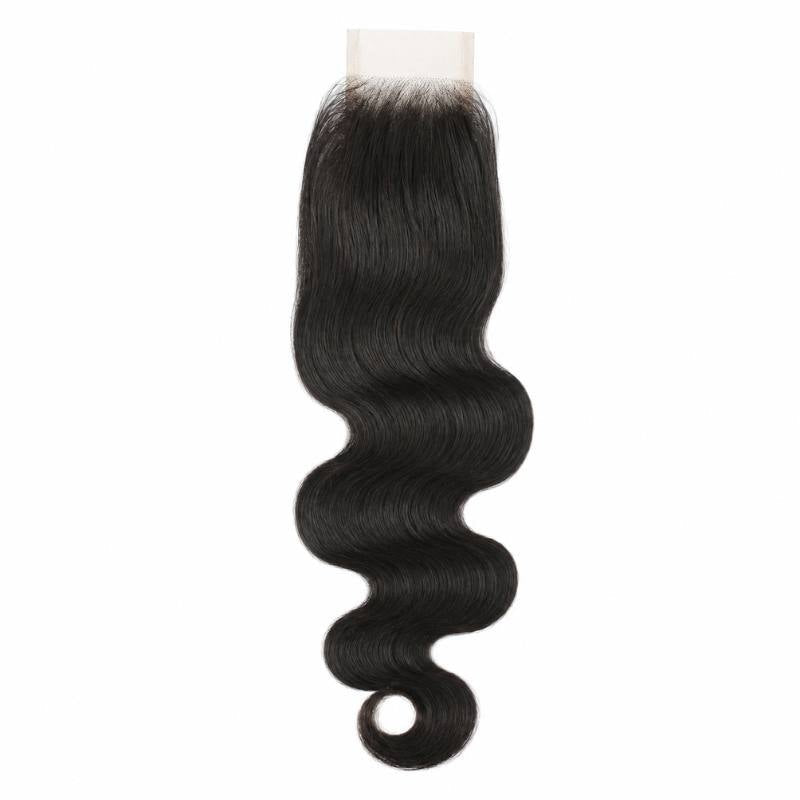 Natural black 2x6 HD closure laid flat on white with the narrow lace panel at the top and body wave hair extensions running to the tip