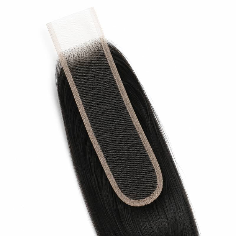 Close-up of the long narrow lace strip on a natural black 2x6 HD closure showing the bound edge and the roots of the hair extensions