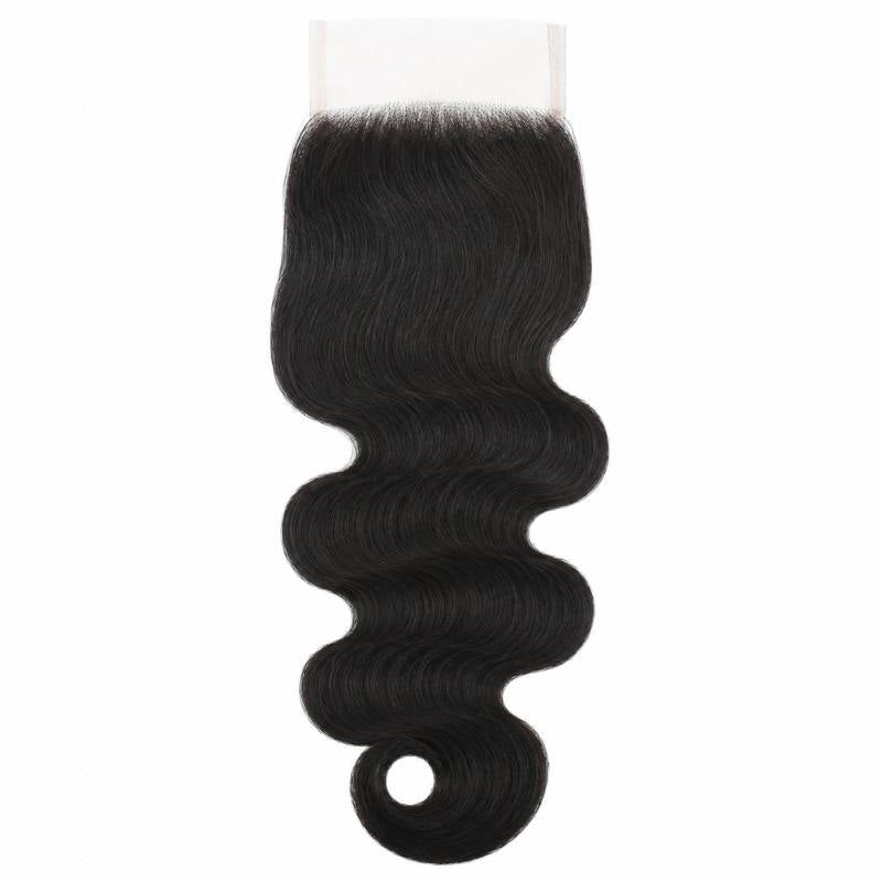 Natural black 4x4 HD closure laid flat on white showing the square lace panel and the body wave hair extensions running to a curled tip