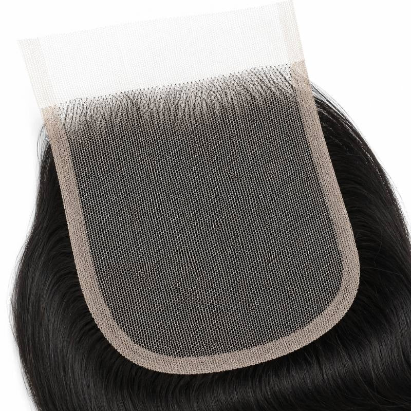 Close-up of the lace mesh and knotted perimeter on a natural black 4x4 transparent closure with body wave hair extensions framing it