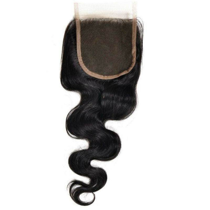 Natural black 4x4 transparent closure turned lace side up on white so the whole square panel and the body wave hair extensions are visible